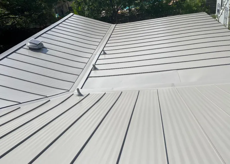 Solar attic fan installed on a metal roof for Roof Ventilation in River Rouge